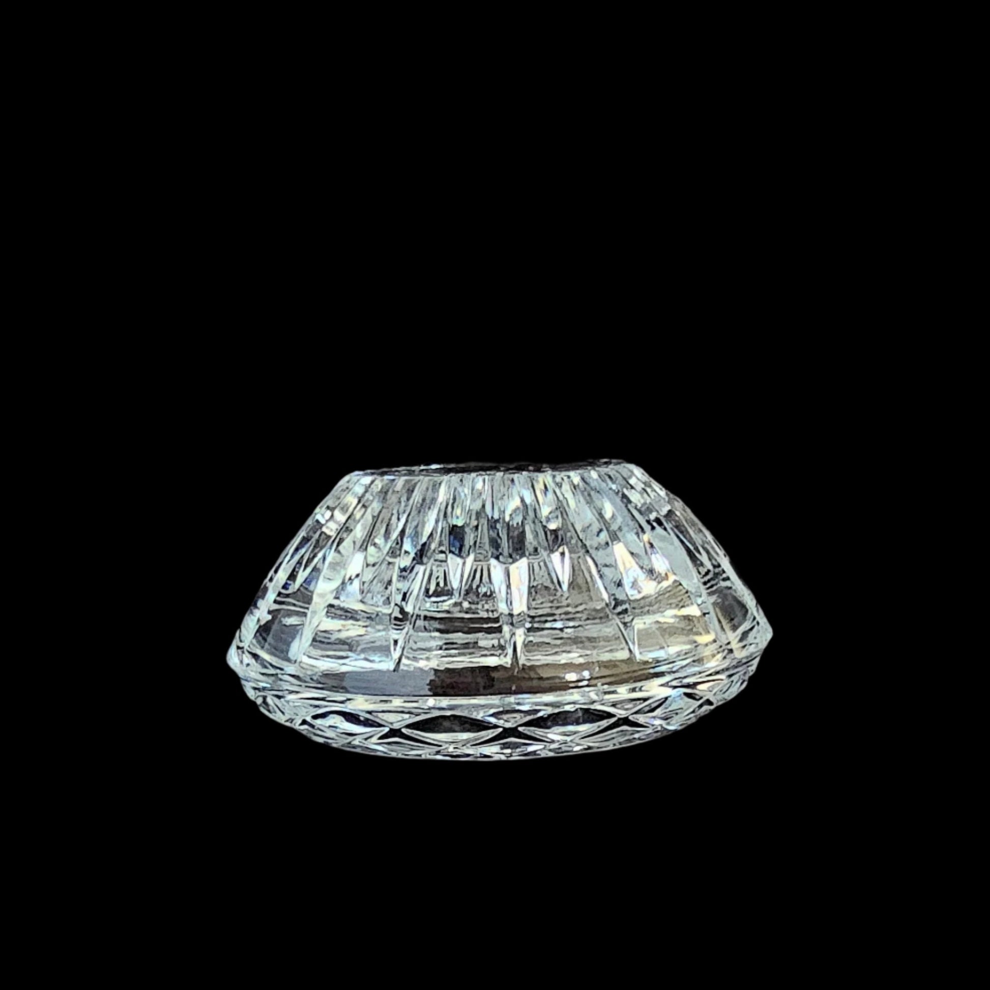 Convertible crystal candle holder, taper-holder side up.