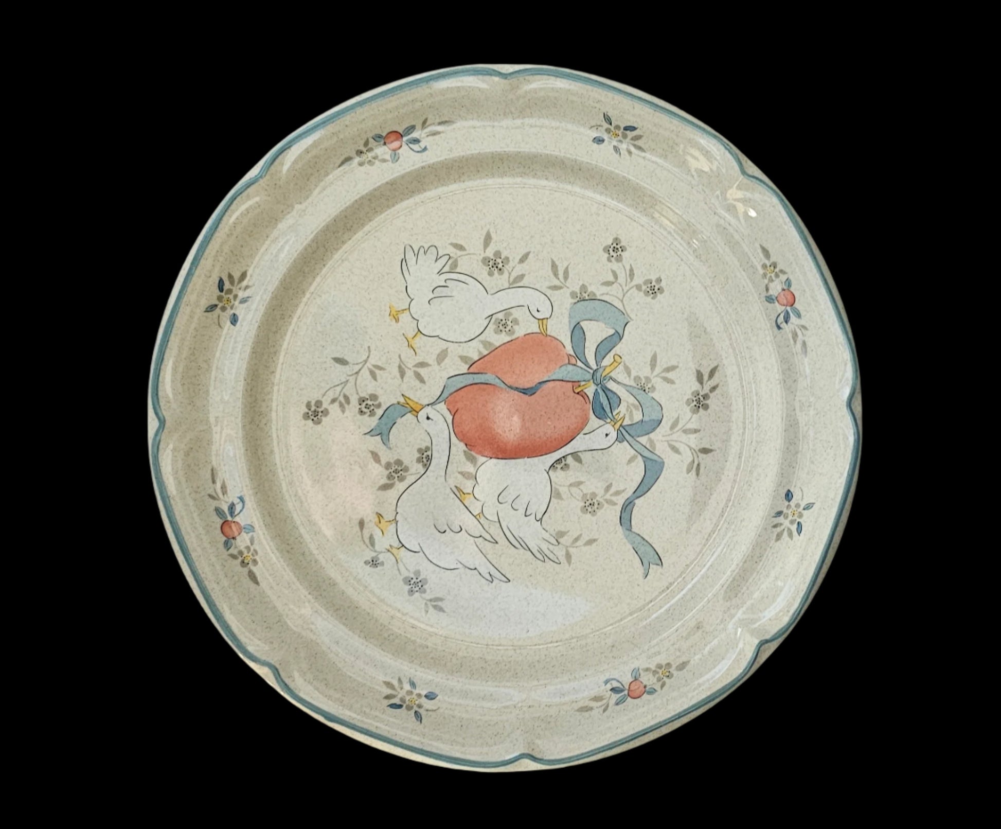 International Tableworks Marmalade pattern dinner plate. Decal shows three white geese with a red apple and blue ribbon.