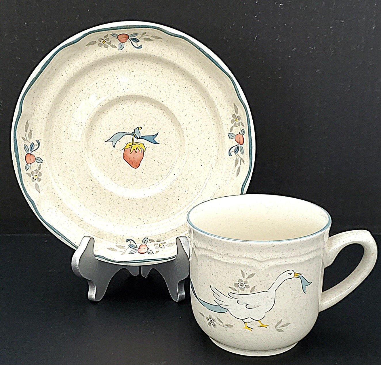 Marmalade Cup and Saucer Set, Vintage International Tableworks (1980s). Speckled Cream Stoneware w/ Geese, Fruits Motif in Red and Blue.