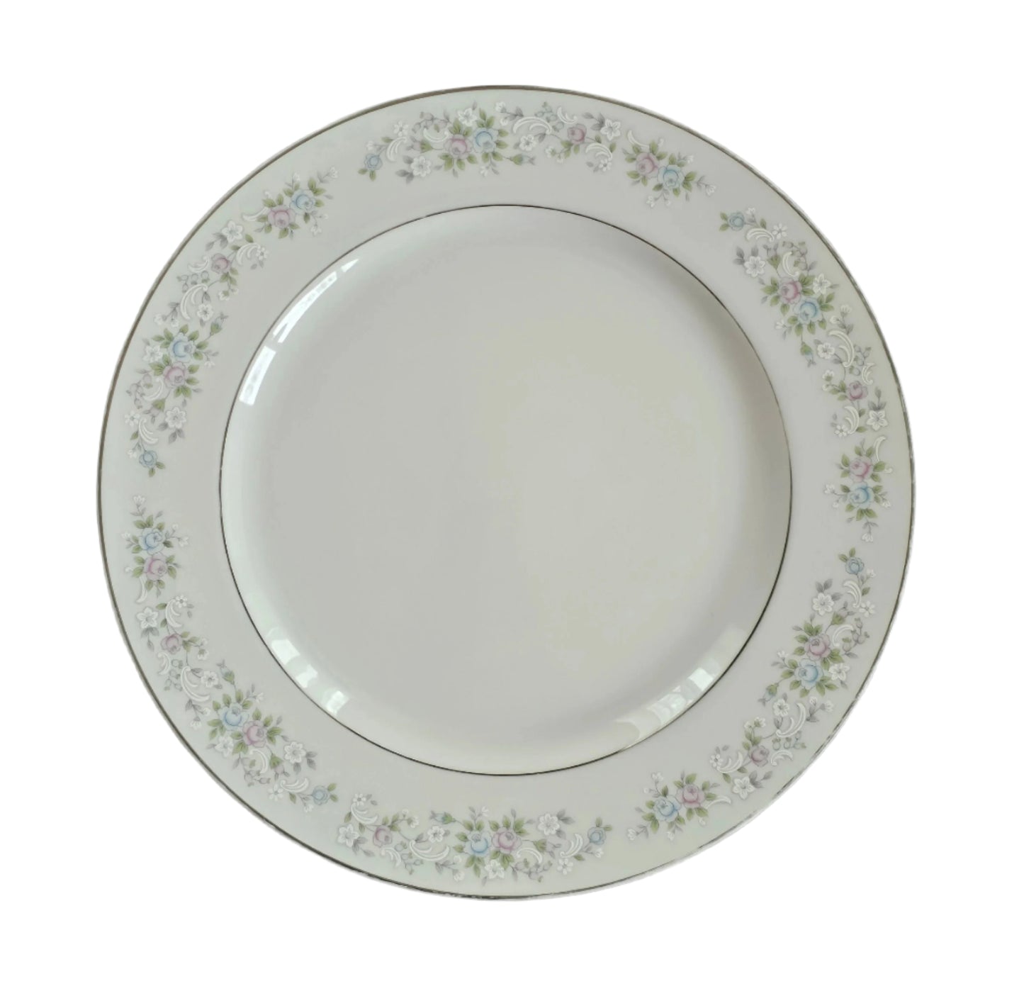 12&quot; Carlion China dinner plate, corsage pattern. White background with blue, pink, and white lights.